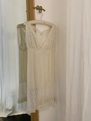 1920s Sheer Cream Silk and Lace Dress with Button Closure.